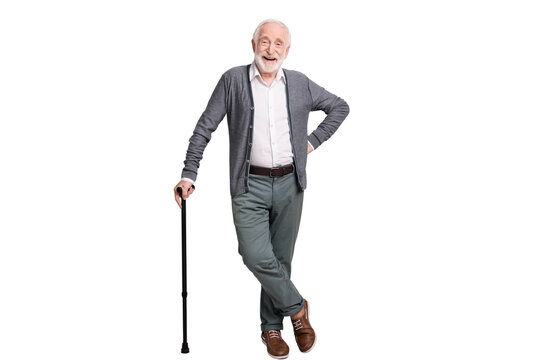 Full size photo of hooray old man stand laugh with wand wear dark sweater trousers isolated on grey wall