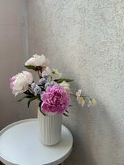 Fresh flowers in the white vase © Natalia