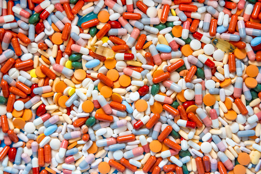 Colorful pills and capsules background texture for healthcare concept