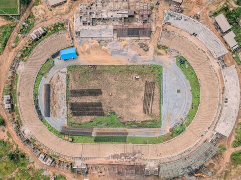 Aerial view of Ahmadu Bello Stadium showing the oval track, seating tiers, and construction zones in Kaduna, Kaduna, Nigeria.