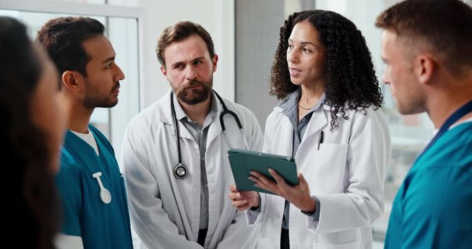 Tablet, medical team and people talk in hospital for schedule, clinical guidelines and smile. Meeting, happy doctors and nurses with tech for healthcare coordination, planning or digital records