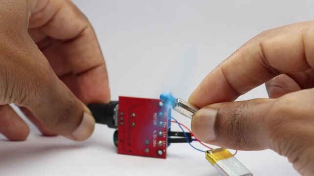 Coreless motor speed controlled by speed controller board and shaft connected to plastic propeller