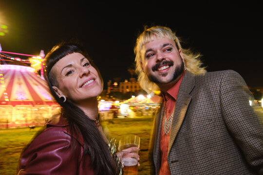 Diverse couple enjoying night festival lifestyle in barcelona