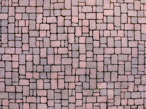 Top view texture of pink and grey concrete cobblestone pavement background