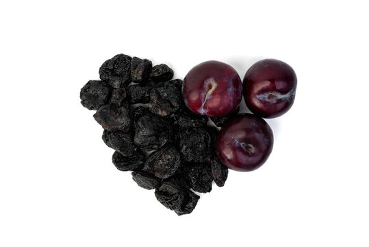 Dried prunes isolated on white background.