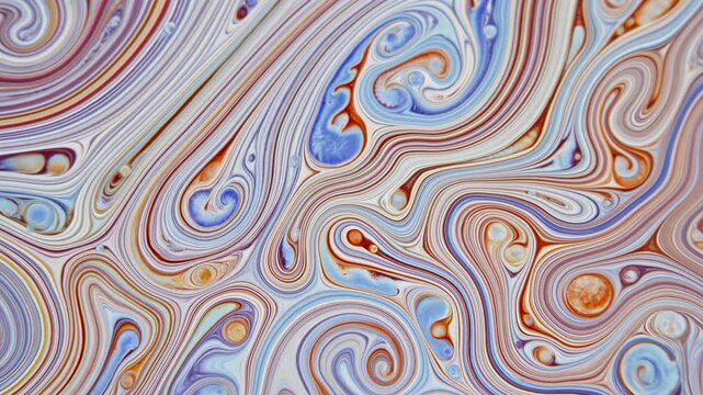 Top-down macro view showing layered pigments forming concentric loops, tight spirals, and flowing bands in pale blue, lavender, cream, rust, and ochre with glossy texture