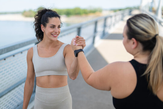 Women fitness team members showing support and motivation