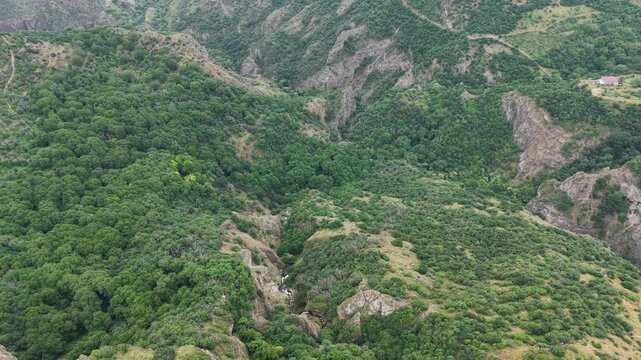 4K Drone Flight Over Dense Mountain Forest and Rocky Cliffs.