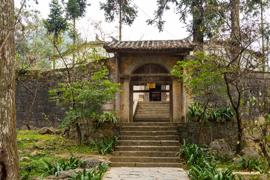 Traditional stone arched gateway leading up ancient stairs, Dinh thu Vua Meo, Vietnam