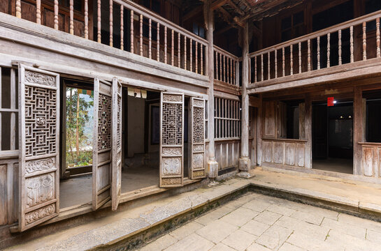 Traditional Vietnamese wooden house courtyard in Dinh thu Vua Meo, Ha Giang, Vietnam