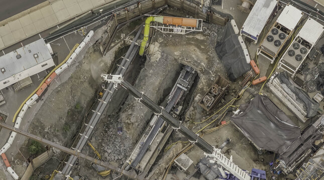 Aerial view of tunnel boring operation by The Boring Company showing heavy machinery, excavation site, and construction equipment in Nashville, TN, United States.