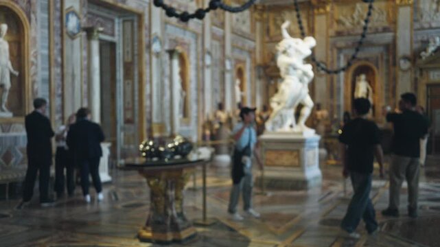 Blurred museum interior with shallow bokeh and soft defocus on ornate marble sculptures, gilded columns and patterned floor, nopeople; background backdrop copyspace.