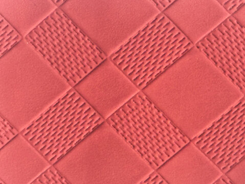 Coral Red Geometric Quilted Embossed Leather Texture Background