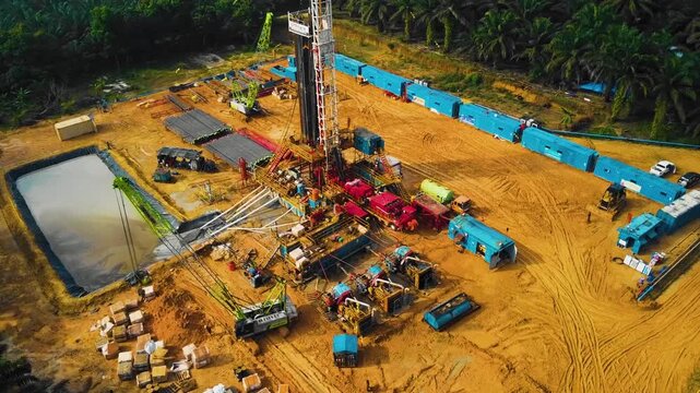 Aerial view of an oil drilling site with machinery and equipment