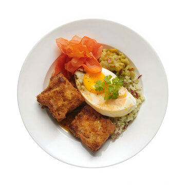 Delicious fried fish with egg and vegetables on plate cutout letter