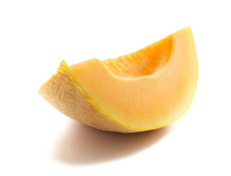 Cantaloupe melon, honeydew slice isolated on white background, side view 	