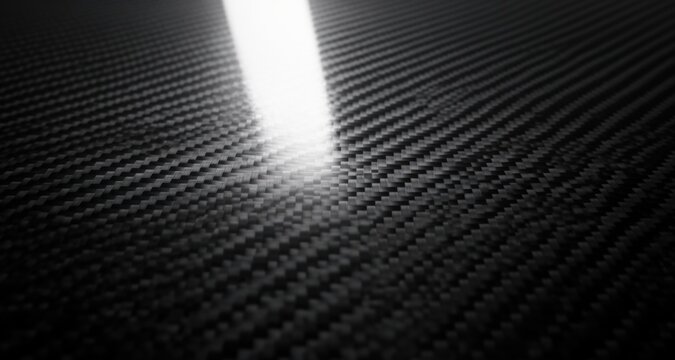  Textured carbon fiber abstract background with glossy surface and light reflections, perfect for mod
