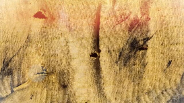 Seamless 4K looping vertical movement across a dirty yellow painted surface with stains and worn texture. Great for abstract backgrounds and grunge visual effects.
