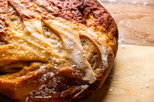 Sourdough Boule loaf on wooden cutting board 
