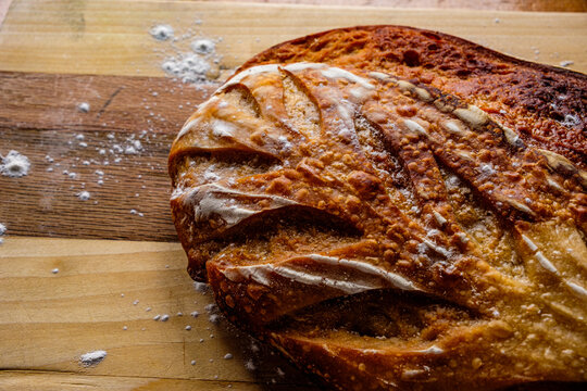 Sourdough Boule loaf on wooden cutting board 
