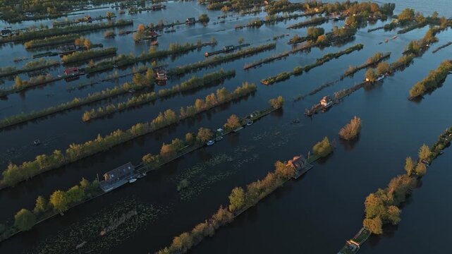 Aerial view of breukelen waterways at sunset in scheendijk