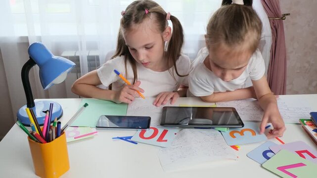 Focused Kids Learning Together in Simple and Calm Digital Minimalist Study Environment