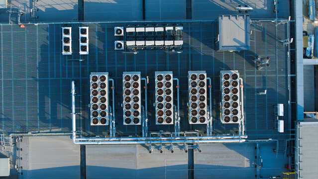 Aerial view of HVAC cooling units installed on the industrial rooftop at Harwell Science and Innovation Campus in Didcot, England, United Kingdom.