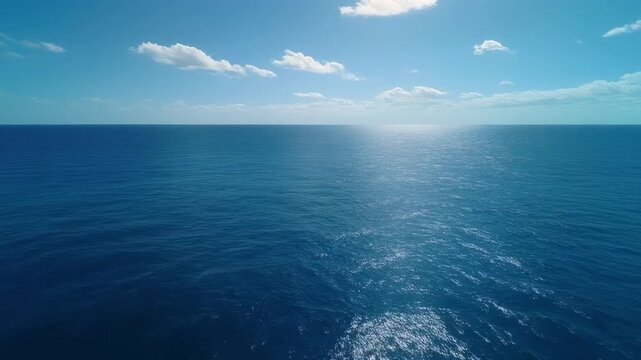 serene aerial ocean waves under bright sky