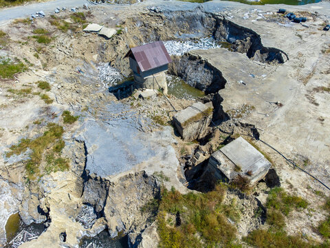 Aerial view of the former salt canyon in Praid, Harghita County - Romania, where in 2025 the salt mine flooded, collapsing the ceilings, an ecological disaster