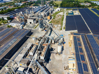Obraz premium Factory area with solar panels and machinery located in industrial zone in daylight