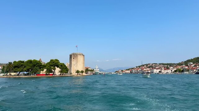 Scenic view of Kamerlengo Castle in Trogir, Croatia, with boats on the Adriatic Sea