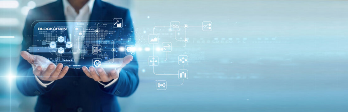 Crypto developer handhold virtual screen Blockchain ledgers while working on laptop to secure assets. Decentralized encryption and transparent transaction records for digital currency.