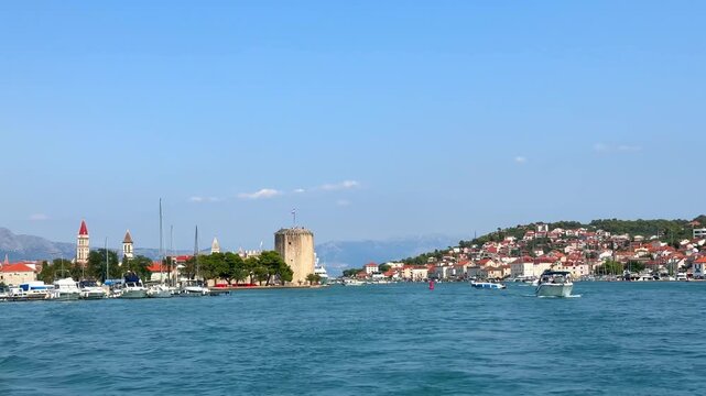 Scenic view of Trogir old town with Kamerlengo fortress and harbor with boats in Croatia