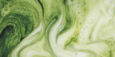 Obraz premium Green liquid marble texture. Abstract fluid paint background with swirling organic patterns.
