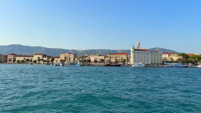 Scenic view of Split city waterfront and harbor in Croatia with historic buildings and mountains in the background