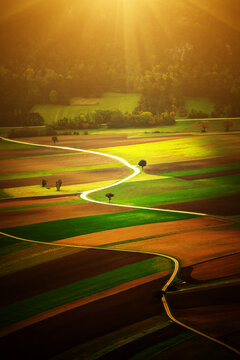 Sunlit Farmland Landscape in Austria, beautiful view with the roads