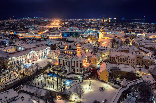 Aerial night View of Tallinn in winter with Alexander Nevsky Cathedral, roofs with snow, Christmas mood