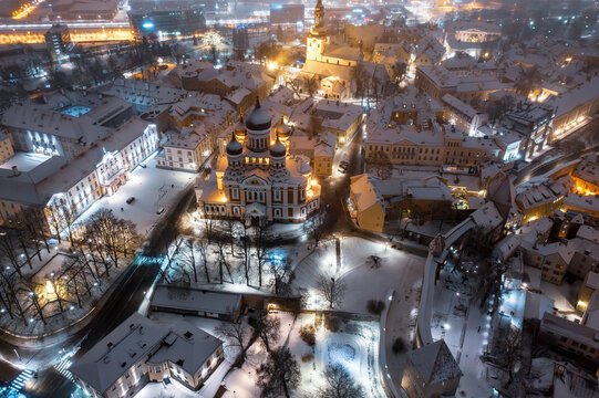 Aerial night View of Tallinn in winter with Alexander Nevsky Cathedral, roofs with snow, Christmas mood