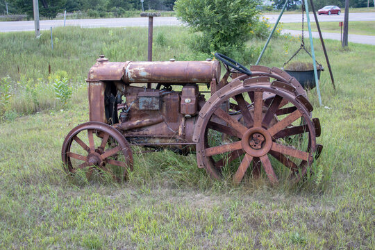 Antique Rusted Iron Farm Tractor with Spiked Steel Wheels