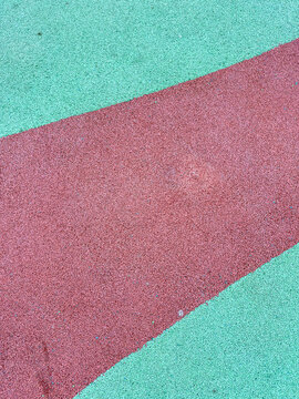 Colorful playground surface with red and green areas