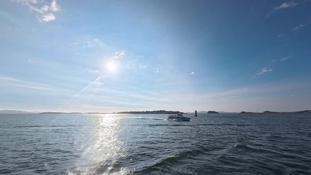 Dynamic seascape with passenger boat and islands for island hopping, cruise, and coastal navigation