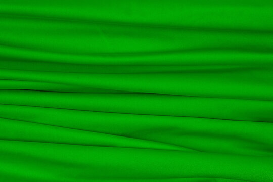 green textile canvas with parallel horizontal folds