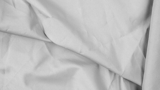 light gray white fabric with diagonal folds and chiaroscuro