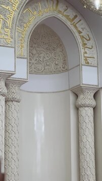Golden calligraphy and beautiful architecture inside Masjid Al Qiblatain in Medina.