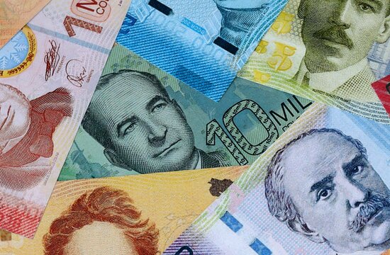 Costa Rican colon money bills in pile on table. Costa Rica CRC currency cash close up