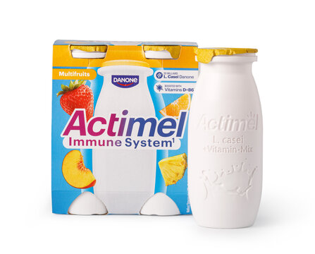 Danone actimel multifruit probiotic yogurt drink pack and bottle on a white background