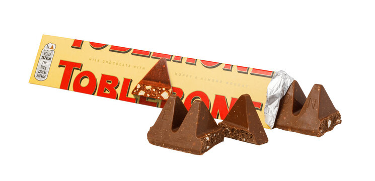 Toblerone milk chocolate bar with triangular pieces on white background