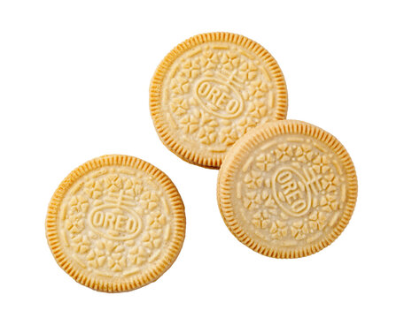 Golden oreo vanilla sandwich cookies on transparent background