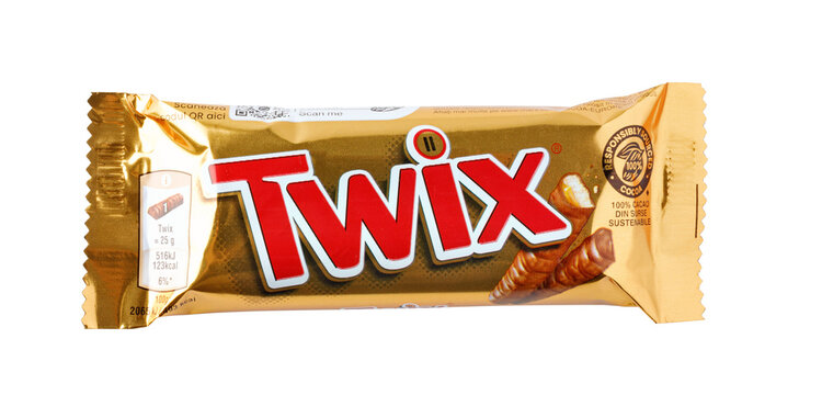 Twix chocolate bar wrapped in golden foil on a transparent background