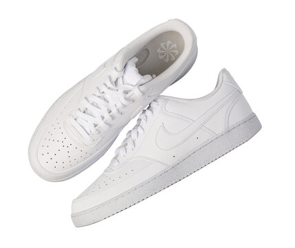 White nike court vision low sneakers on a transparent background